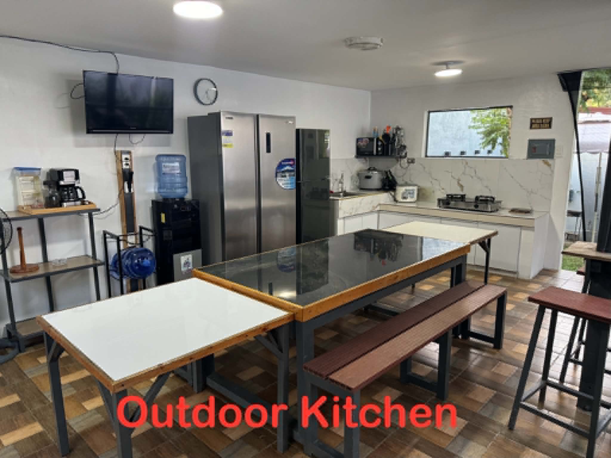 Villa 1 outdoor kitchen and dining area